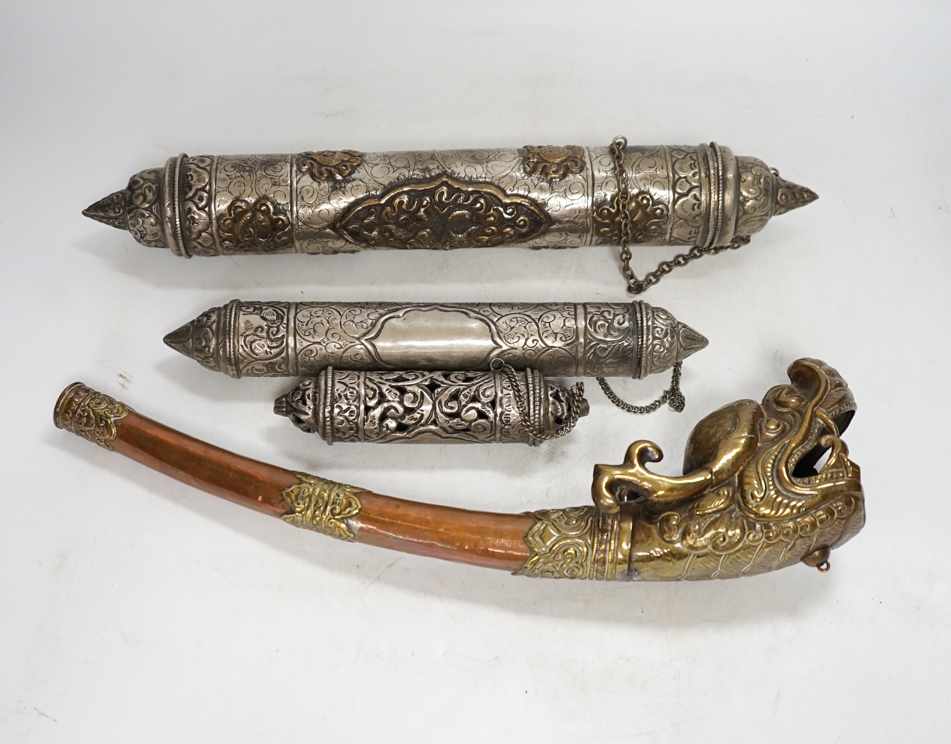 Three Tibetan scroll holders and a 'dragon' trumpet, trumpet 38cm long. Condition - fair to good